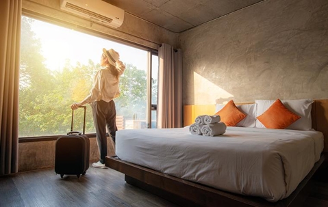 A woman standing in a luxury hotel room